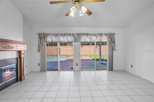 3137 Timucua Cir, Orlando, FL 32837 - unfurnished living room featuring plenty of natural light, a tile fireplace, ceiling fan, and tile patterned flooring