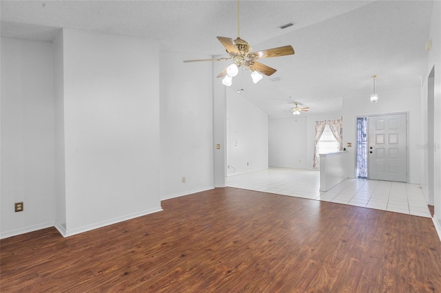 3137 Timucua Cir, Orlando, FL 32837 - empty room with a ceiling fan, wood finished floors, and vaulted ceiling