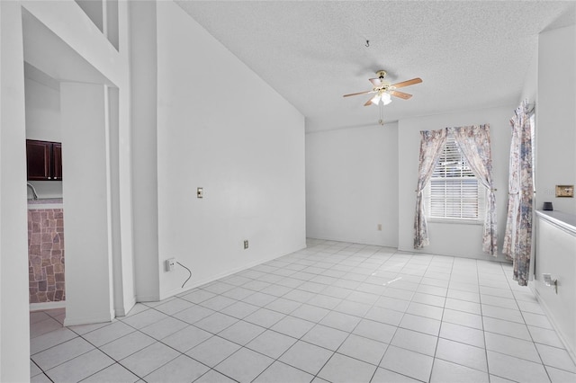 3137 Timucua Cir, Orlando, FL 32837 - spare room featuring ceiling fan, a textured ceiling, and light tile patterned floors
