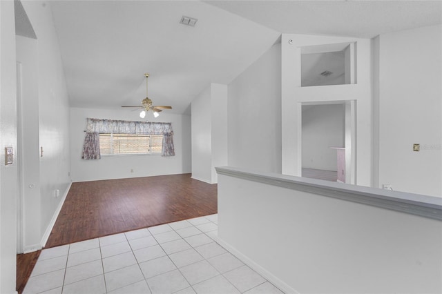 3137 Timucua Cir, Orlando, FL 32837 - unfurnished room with vaulted ceiling, wood finished floors, and ceiling fan