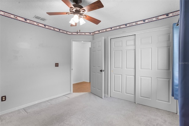 3137 Timucua Cir, Orlando, FL 32837 - unfurnished bedroom with light carpet, a closet, and a ceiling fan