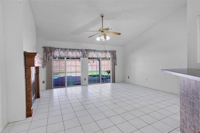3137 Timucua Cir, Orlando, FL 32837 - unfurnished living room featuring lofted ceiling, a ceiling fan, a fireplace, light tile patterned flooring, and a textured ceiling