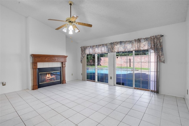 3137 Timucua Cir, Orlando, FL 32837 - unfurnished living room with lofted ceiling, healthy amount of natural light, ceiling fan, a fireplace, and a textured ceiling