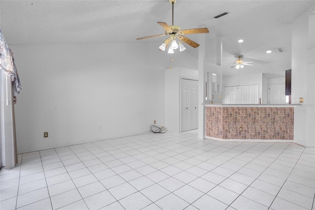 3137 Timucua Cir, Orlando, FL 32837 - unfurnished living room with ceiling fan, vaulted ceiling, recessed lighting, and a textured ceiling