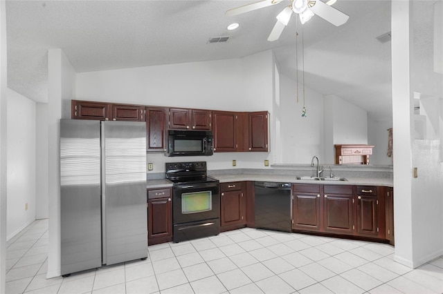 3137 Timucua Cir, Orlando, FL 32837 - kitchen with black appliances, lofted ceiling, light countertops, ceiling fan, and light tile patterned floors