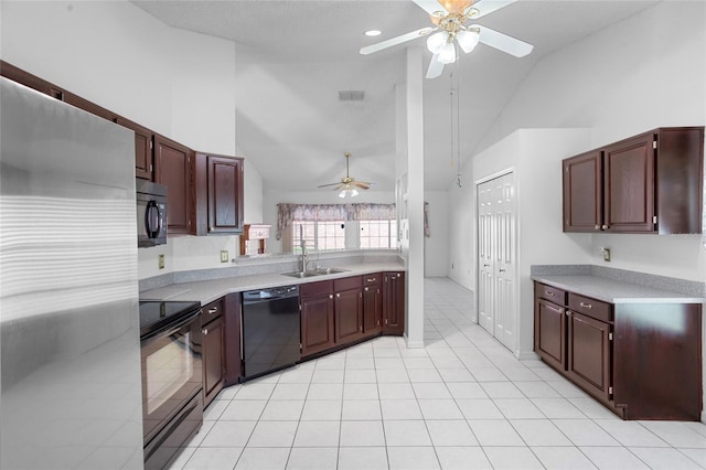 3137 Timucua Cir, Orlando, FL 32837 - kitchen with black appliances, ceiling fan, high vaulted ceiling, light countertops, and light tile patterned floors