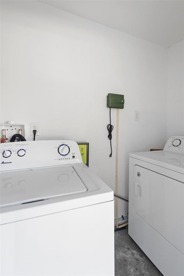laundry area featuring laundry area and washer and clothes dryer