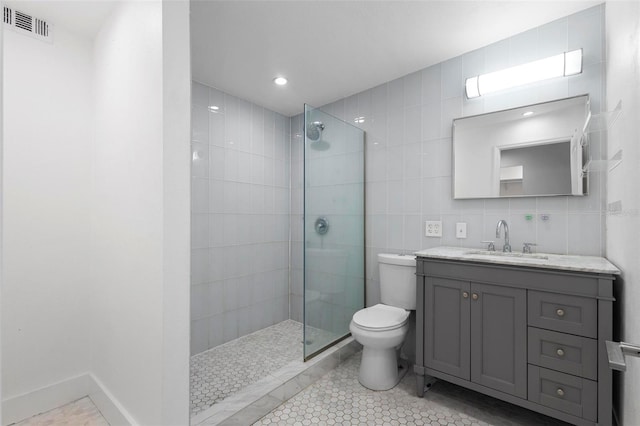 bathroom featuring walk in shower, toilet, tile walls, visible vents, and tile patterned flooring