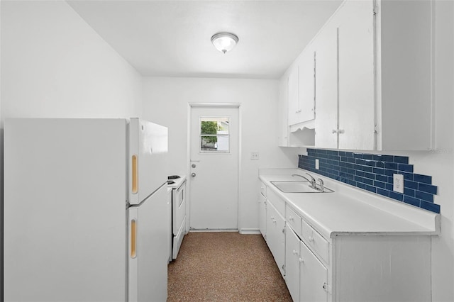 kitchen with white appliances, a sink, backsplash, light countertops, and white cabinets
