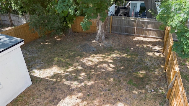 view of yard with a fenced backyard
