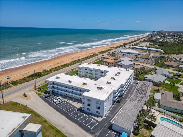 bird's eye view with a water view and a view of the beach