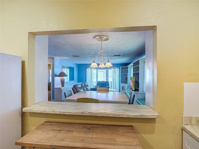 dining area featuring a chandelier