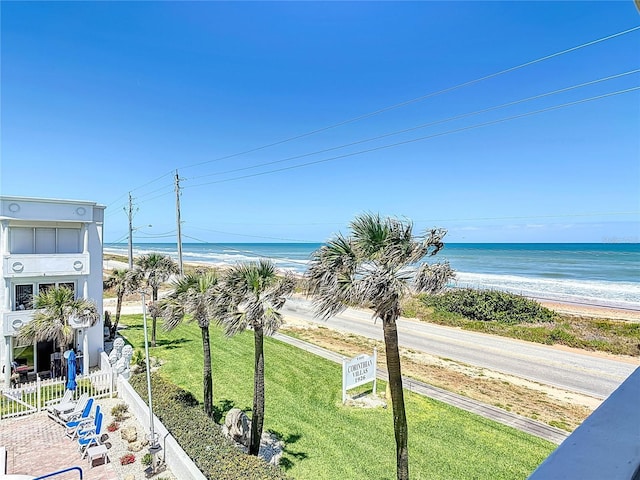 water view with a beach view and fence