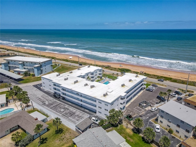 bird's eye view featuring a water view and a view of the beach