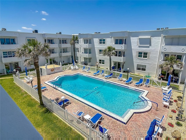 pool featuring a patio and fence