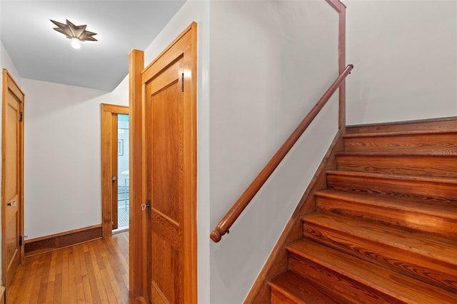 806 E Amelia St, Orlando, FL 32803 - staircase with baseboards and hardwood / wood-style flooring