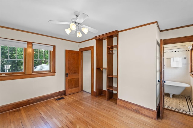 806 E Amelia St, Orlando, FL 32803 - unfurnished bedroom featuring baseboards, crown molding, light wood-style flooring, and visible vents