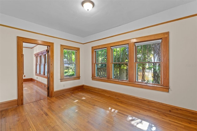 806 E Amelia St, Orlando, FL 32803 - spare room with baseboards and hardwood / wood-style floors