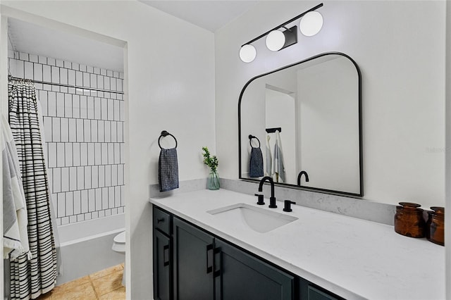 bathroom with toilet, tile patterned floors, shower / bathtub combination with curtain, and vanity