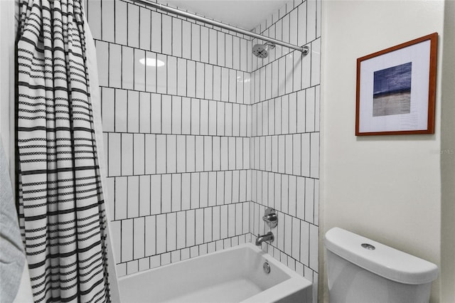 bathroom with toilet and shower / tub combo