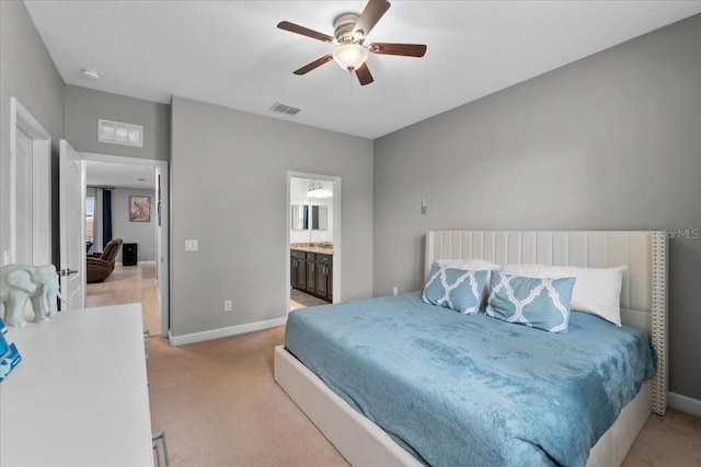 9009 Savannah Julip Ln, Orlando, FL 32832 - bedroom with light carpet, baseboards, a ceiling fan, and connected bathroom