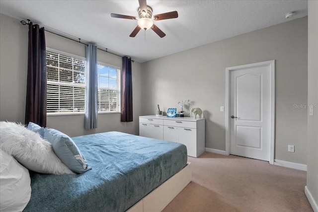 9009 Savannah Julip Ln, Orlando, FL 32832 - bedroom featuring light carpet, baseboards, and a ceiling fan