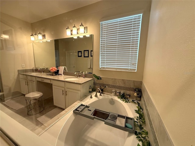 full bathroom featuring double vanity, a sink, and a bath
