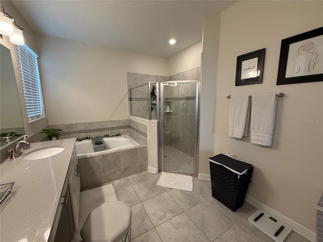bathroom featuring vanity, tile patterned floors, a garden tub, and a stall shower