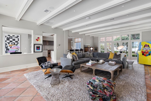 1640 E Adams Dr, Maitland, FL 32751 - living room featuring beam ceiling, baseboards, and tile patterned flooring