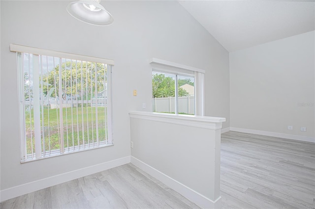 13434 Mallard Cove Blvd, Orlando, FL 32837 - spare room with high vaulted ceiling, wood finished floors, and baseboards