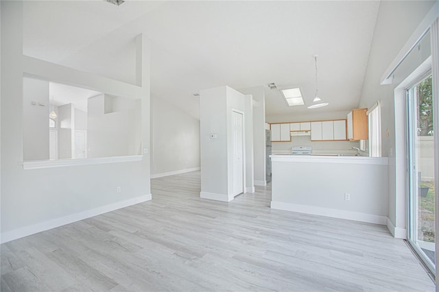 13434 Mallard Cove Blvd, Orlando, FL 32837 - unfurnished living room featuring vaulted ceiling, light wood-type flooring, a sink, and baseboards