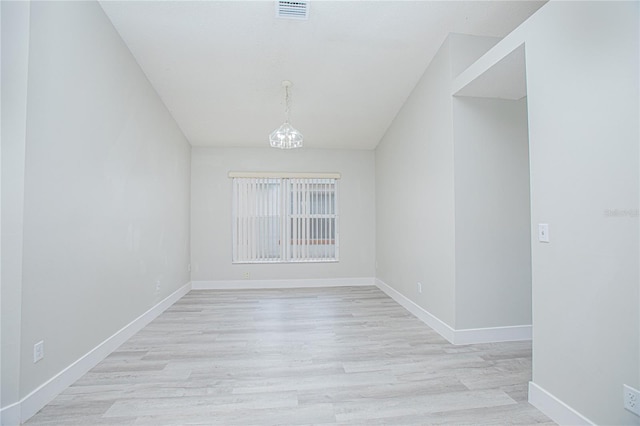 13434 Mallard Cove Blvd, Orlando, FL 32837 - unfurnished room with a chandelier, baseboards, and light wood-type flooring