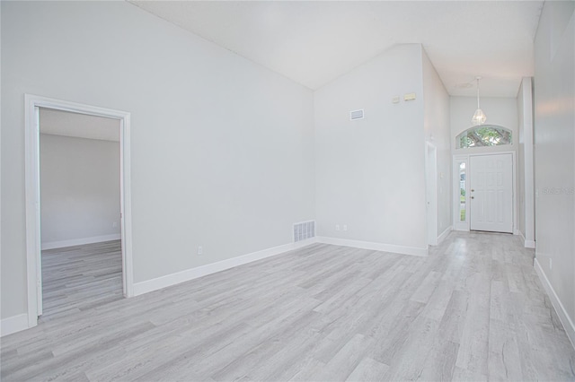 13434 Mallard Cove Blvd, Orlando, FL 32837 - entrance foyer featuring high vaulted ceiling, light wood-type flooring, and baseboards