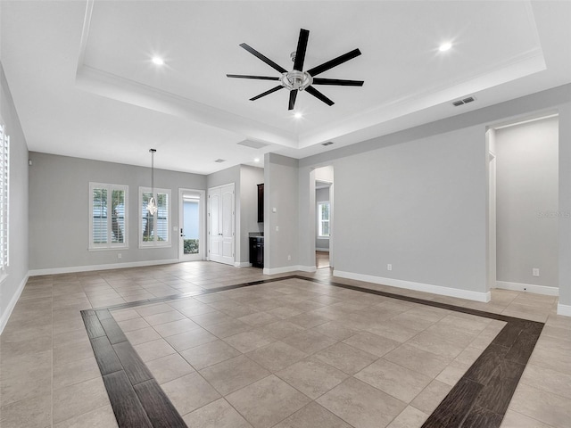 unfurnished living room with light tile patterned floors, a raised ceiling, ceiling fan, and recessed lighting