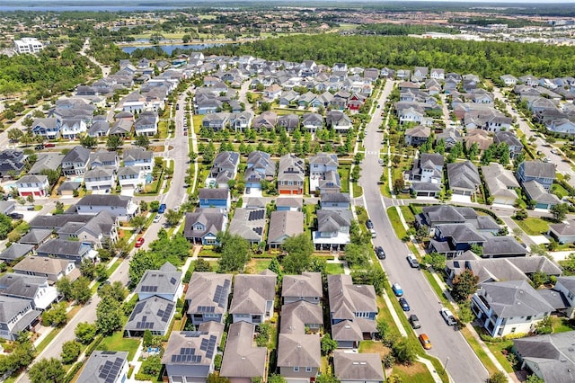 bird's eye view with a residential view and a water view