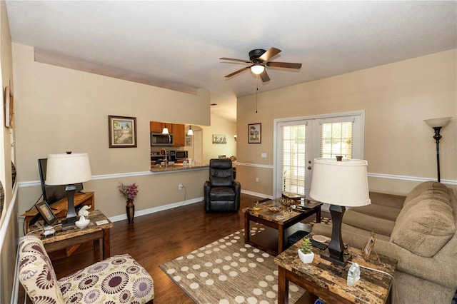 living room with french doors, baseboards, a ceiling fan, and dark wood-style flooring