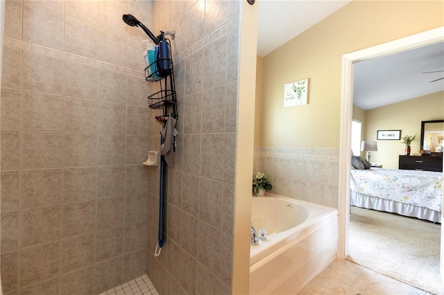 bathroom featuring tile patterned floors, a tile shower, a garden tub, and ensuite bath