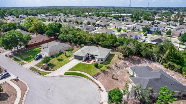 birds eye view of property with a residential view