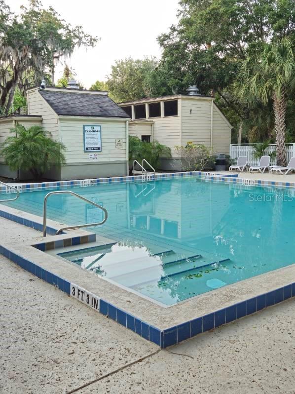 community pool featuring fence