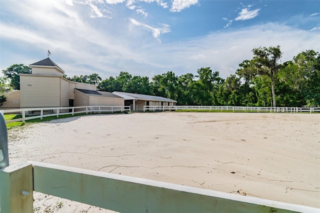 112 Crown Oaks Way Unit 112, Longwood, FL 32779 - view of property's community featuring an outdoor riding arena, fence, an outdoor structure, and view of scattered trees