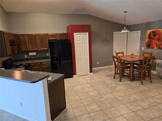 119 Stewart Lake Loop, Groveland, FL 34736 - kitchen featuring black appliances, dark countertops, lofted ceiling, a peninsula, and hanging light fixtures