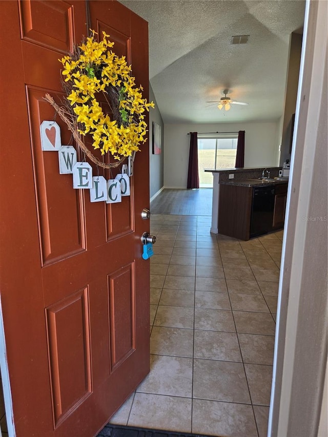 119 Stewart Lake Loop, Groveland, FL 34736 - entrance foyer with ceiling fan, light tile patterned floors, and a textured ceiling