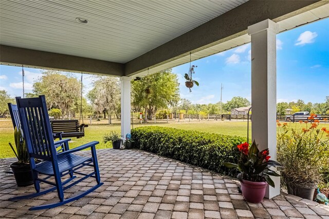 view of patio featuring fence