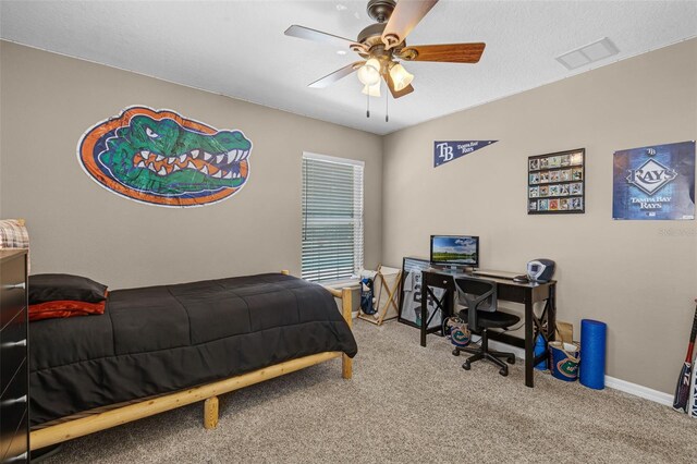 bedroom with carpet flooring, baseboards, visible vents, and ceiling fan