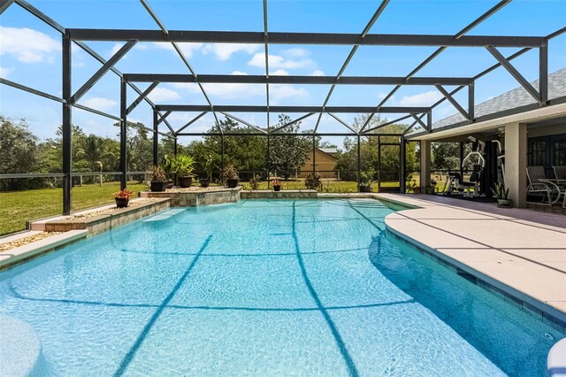 outdoor pool featuring a patio and a lanai