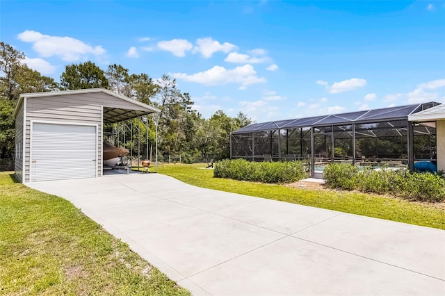 garage featuring concrete driveway