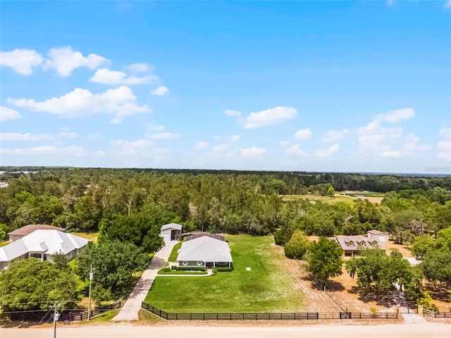 birds eye view of property featuring a wooded view