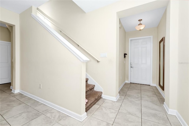 2919 Verse St, Kissimmee, FL 34746 - entrance foyer featuring baseboards, stairs, and light tile patterned floors