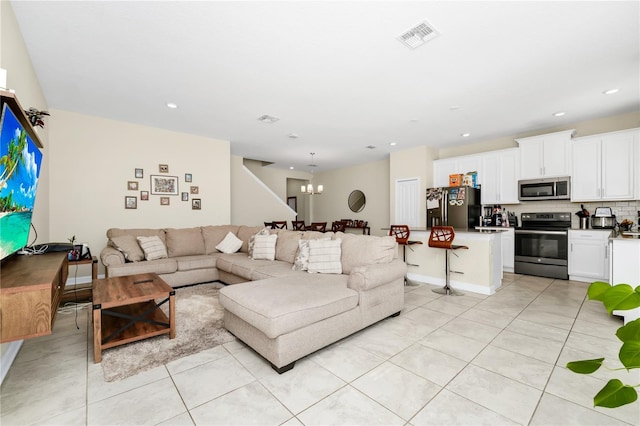 2919 Verse St, Kissimmee, FL 34746 - living room featuring light tile patterned flooring, visible vents, an inviting chandelier, and recessed lighting
