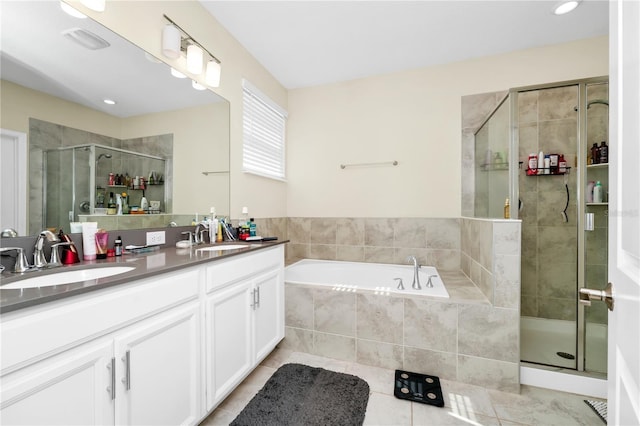 2919 Verse St, Kissimmee, FL 34746 - full bathroom featuring a sink, double vanity, a shower stall, and a bath